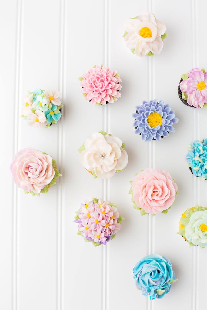 Flower cupcakes on a white table.
