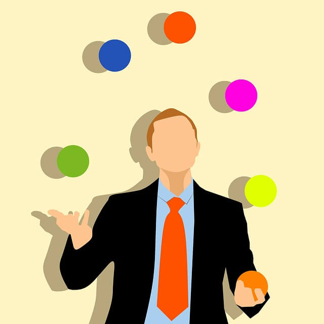 A juggling businessman.  