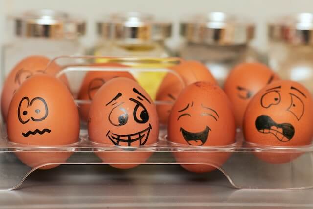 How Non-Verbal Communication Can Affect Productivity in the Workplace/.
Eggs with various facial expressions drawn on. 